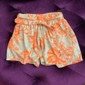 Sassy shorts. Neon orange with beige